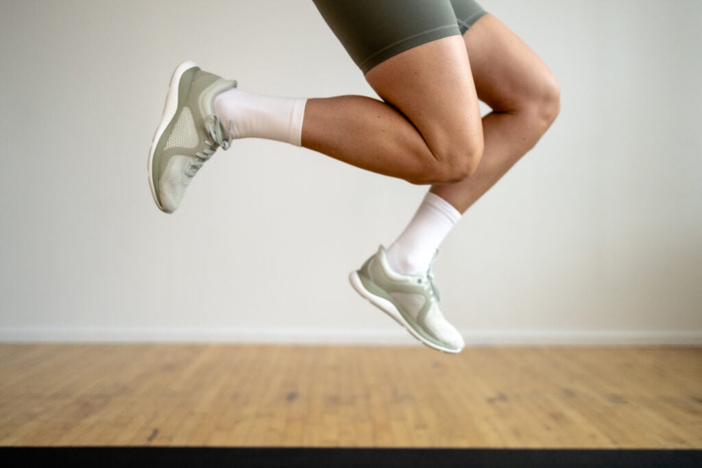 woman jumping in new lululemon chargefeel training shoes