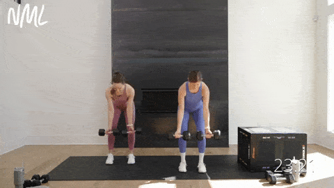 Two women performing reverse grip back rows as part of dumbbell workout for women