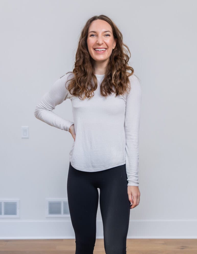 Women wearing a white hold tight long sleeve and black align mini flare leggings.