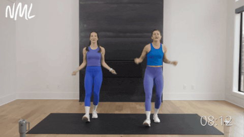 two women jumping rope in place as part of at home cardio workout