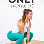 woman performing squat as part of dumbbell workout