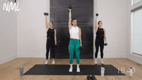 three women performing a dumbbell bicep curl and shoulder press 
