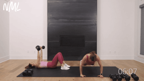 two women performing push ups as example of best upper body exercises for women
