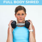 woman holding a dumbbell at her chest