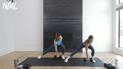 two women performing a compound exercise as part of full body 30 minute workout at home