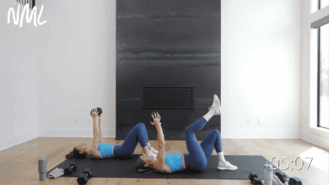 two women performing single leg glute bridges with a skull crusher as part of 30 minute workout at home