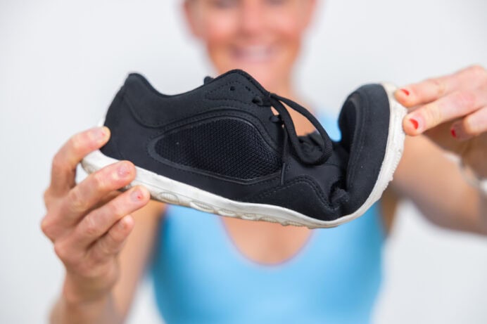 Women showing the bend in a barefoot shoe women.