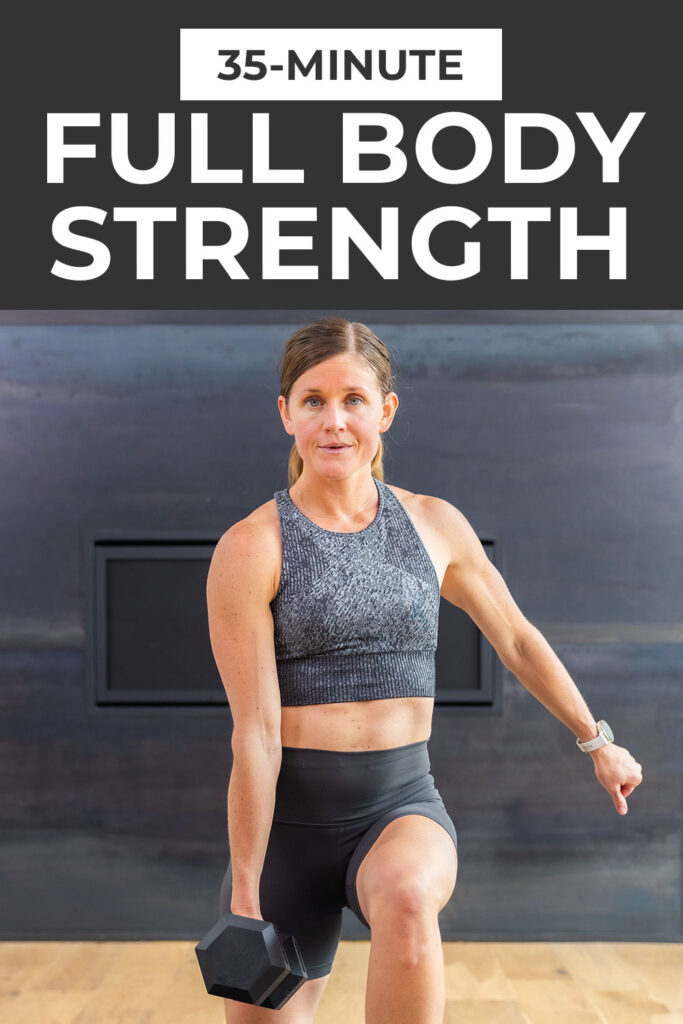 black fireplace with woman standing in front of it performing home workout