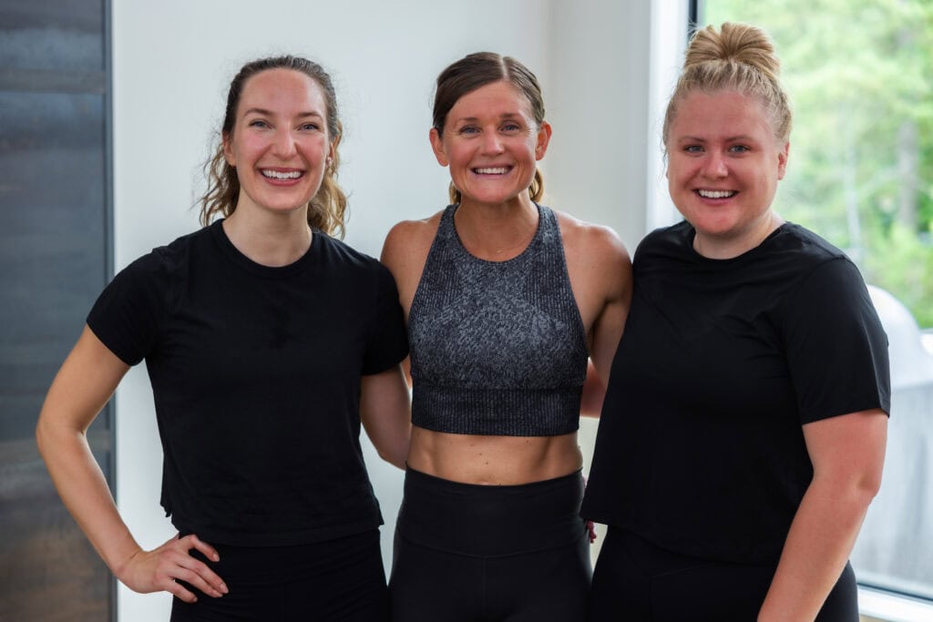 3 women smiling after completing home workout