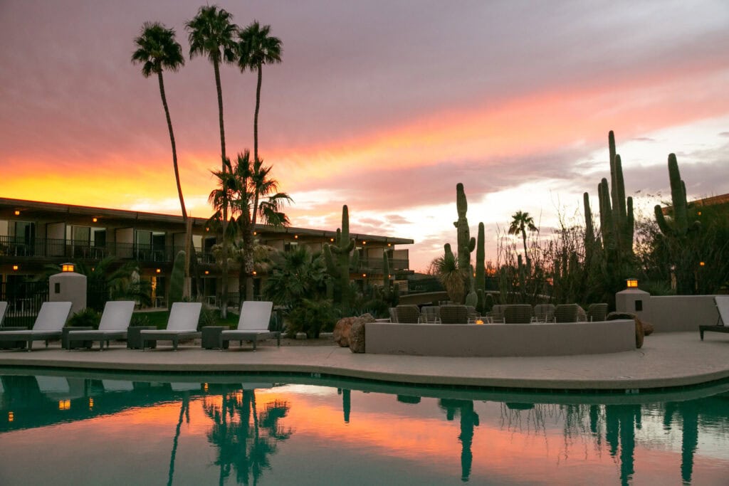 sunset pool and lounge chairs at civana resort and spa